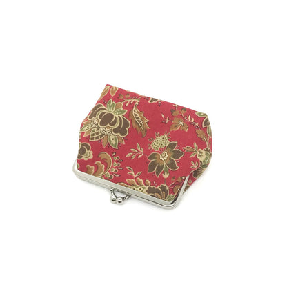 rote Clipbörse mit Blumenmuster